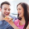 Young couple eating pizza.jpg