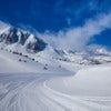 Fresh ski slope and mountains.jpg